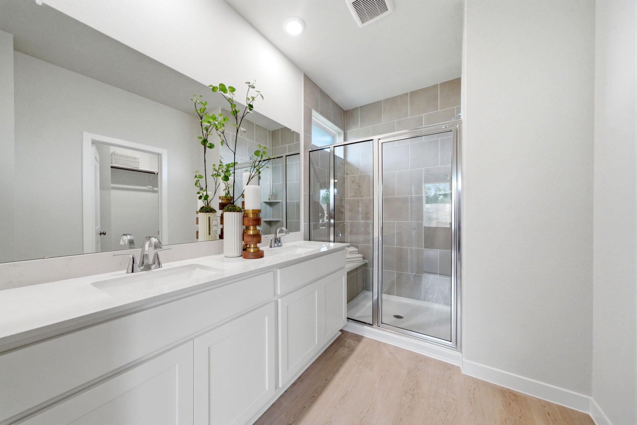 A bathroom with a glass shower.