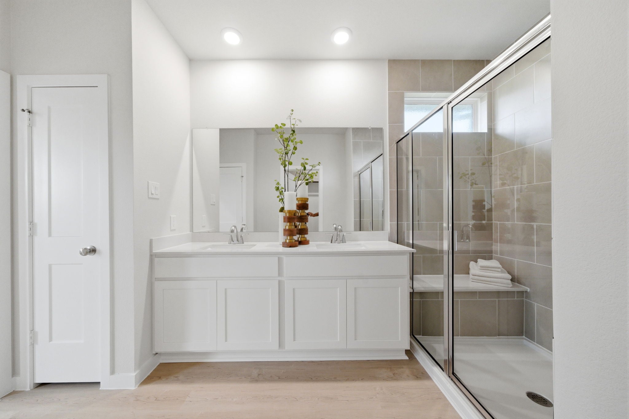 A bathroom with a glass shower.