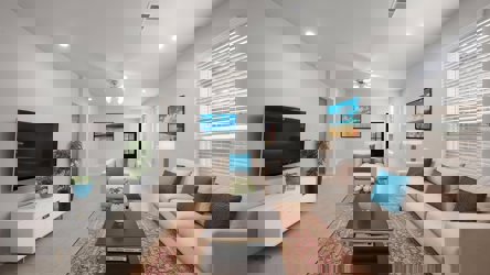 A living room with a tv and couches.