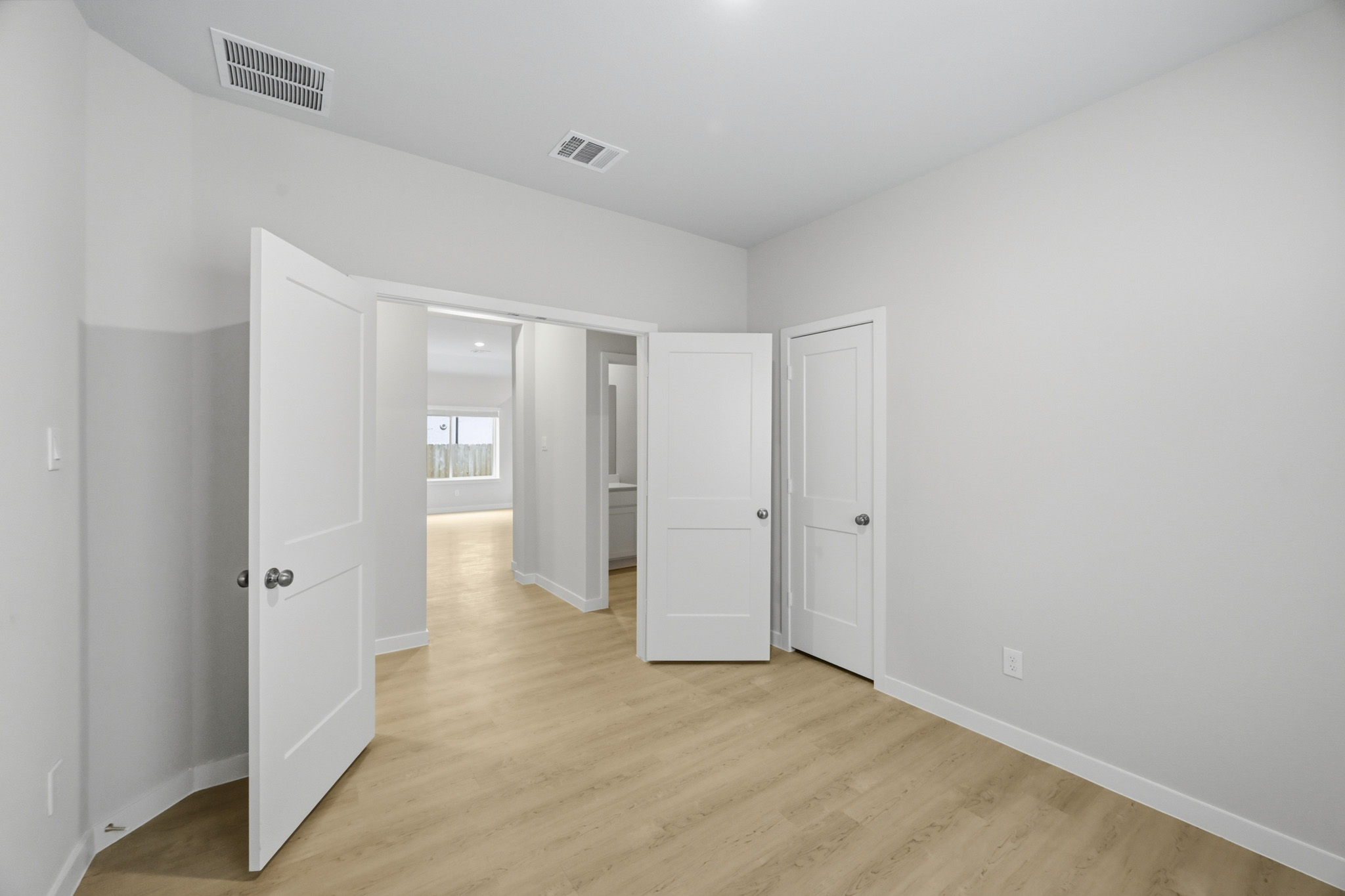 A room with white doors.