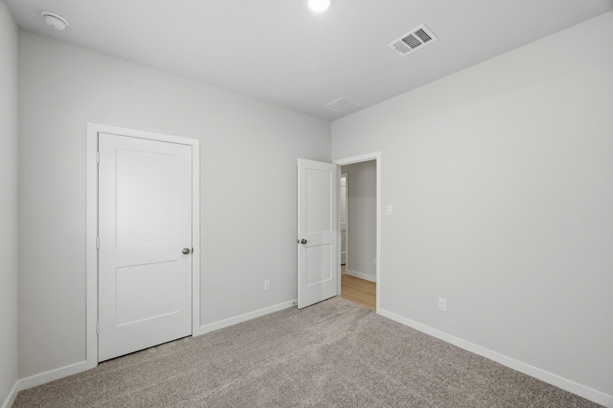 A room with white doors.