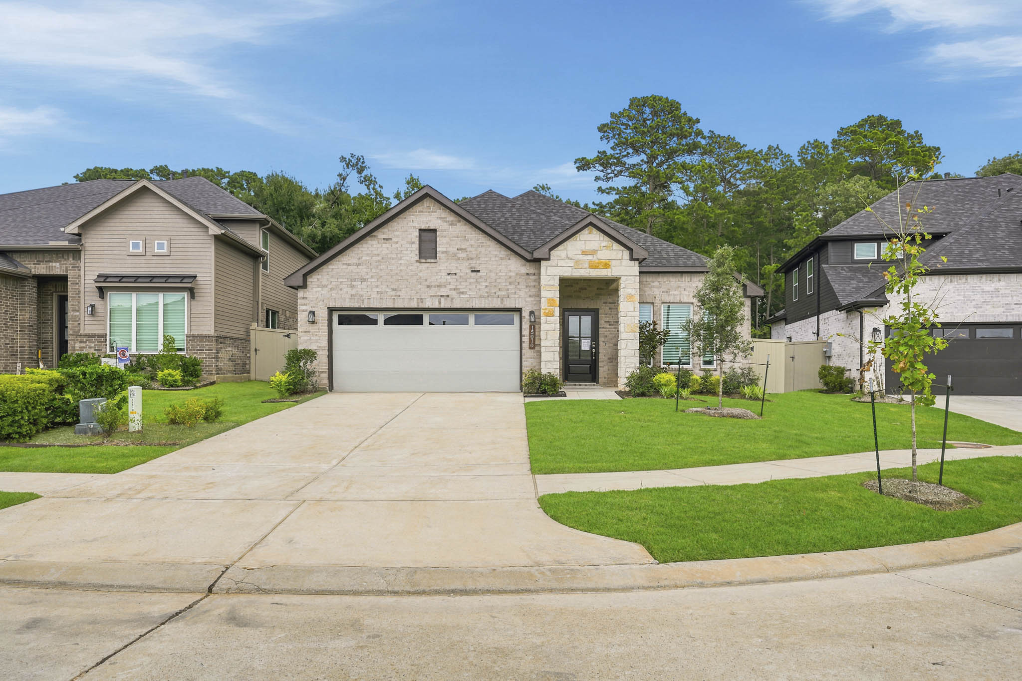 A driveway leading to a house.