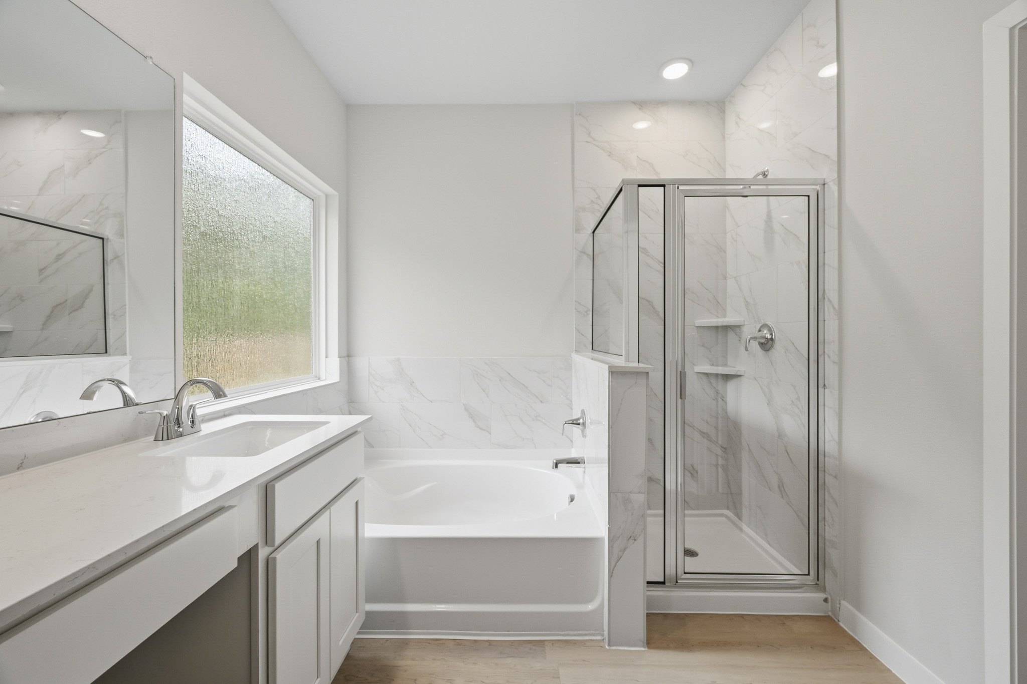 A bathroom with a glass shower.