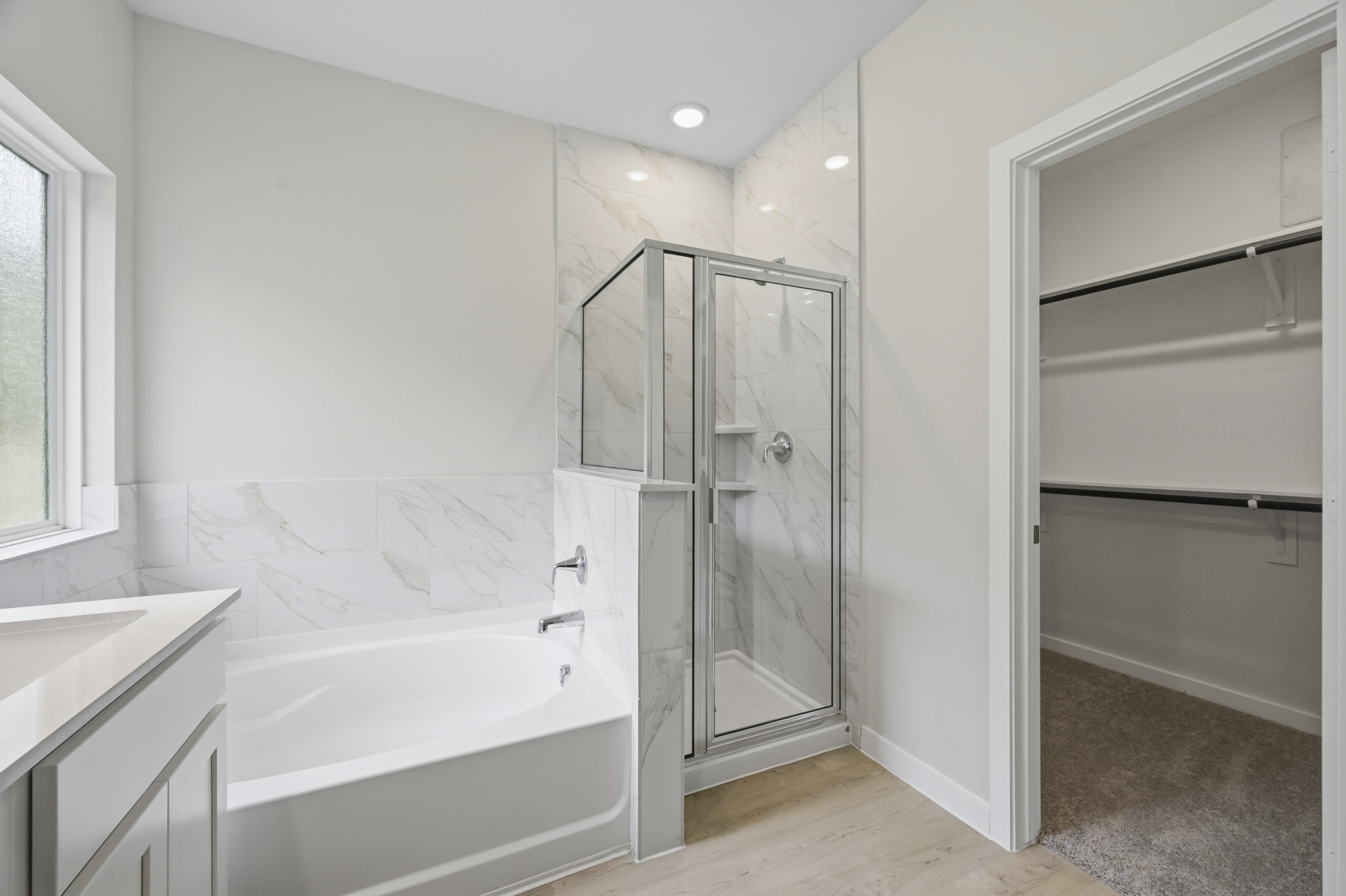 A bathroom with a glass shower.