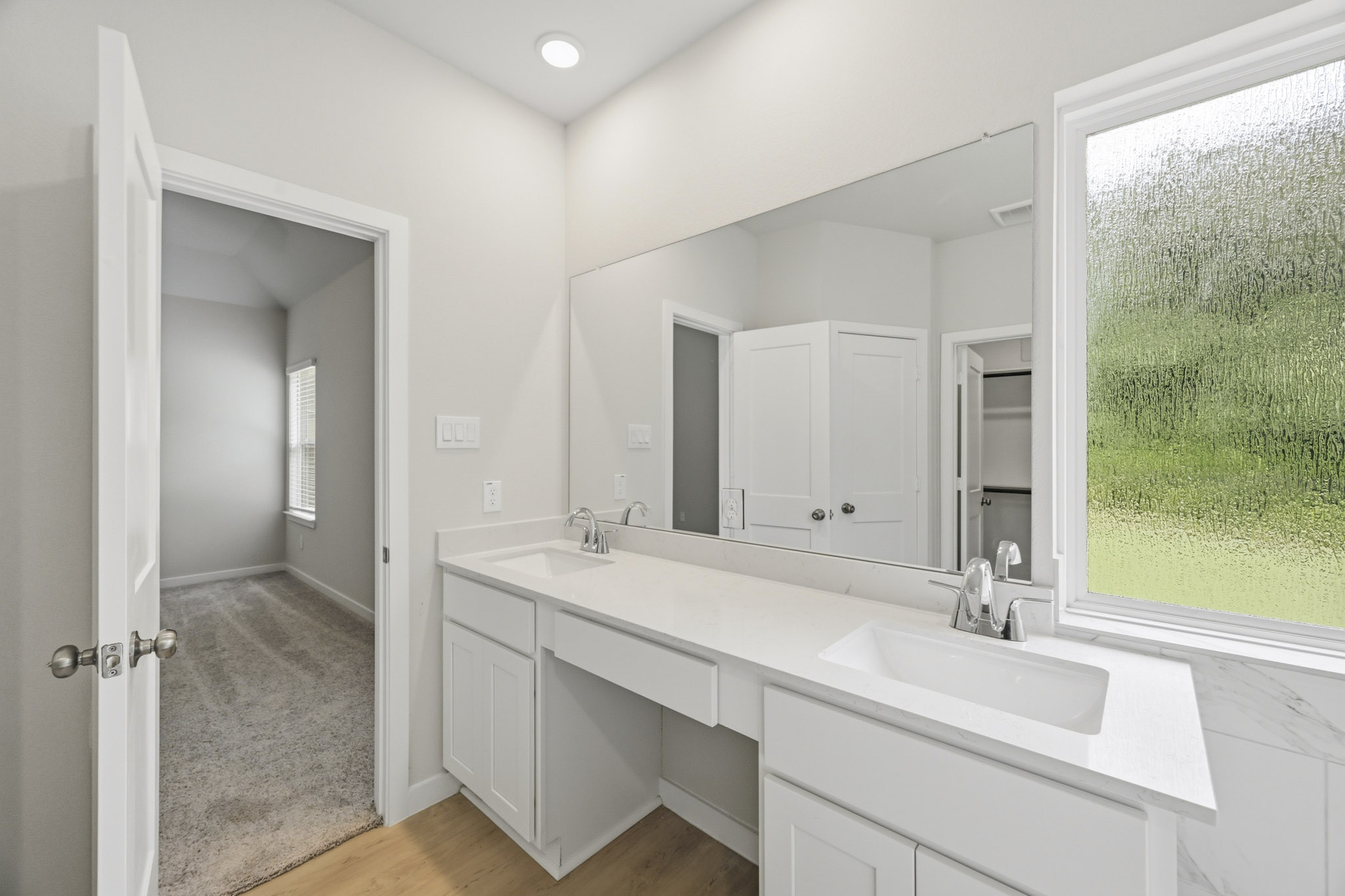 A bathroom with a large window.