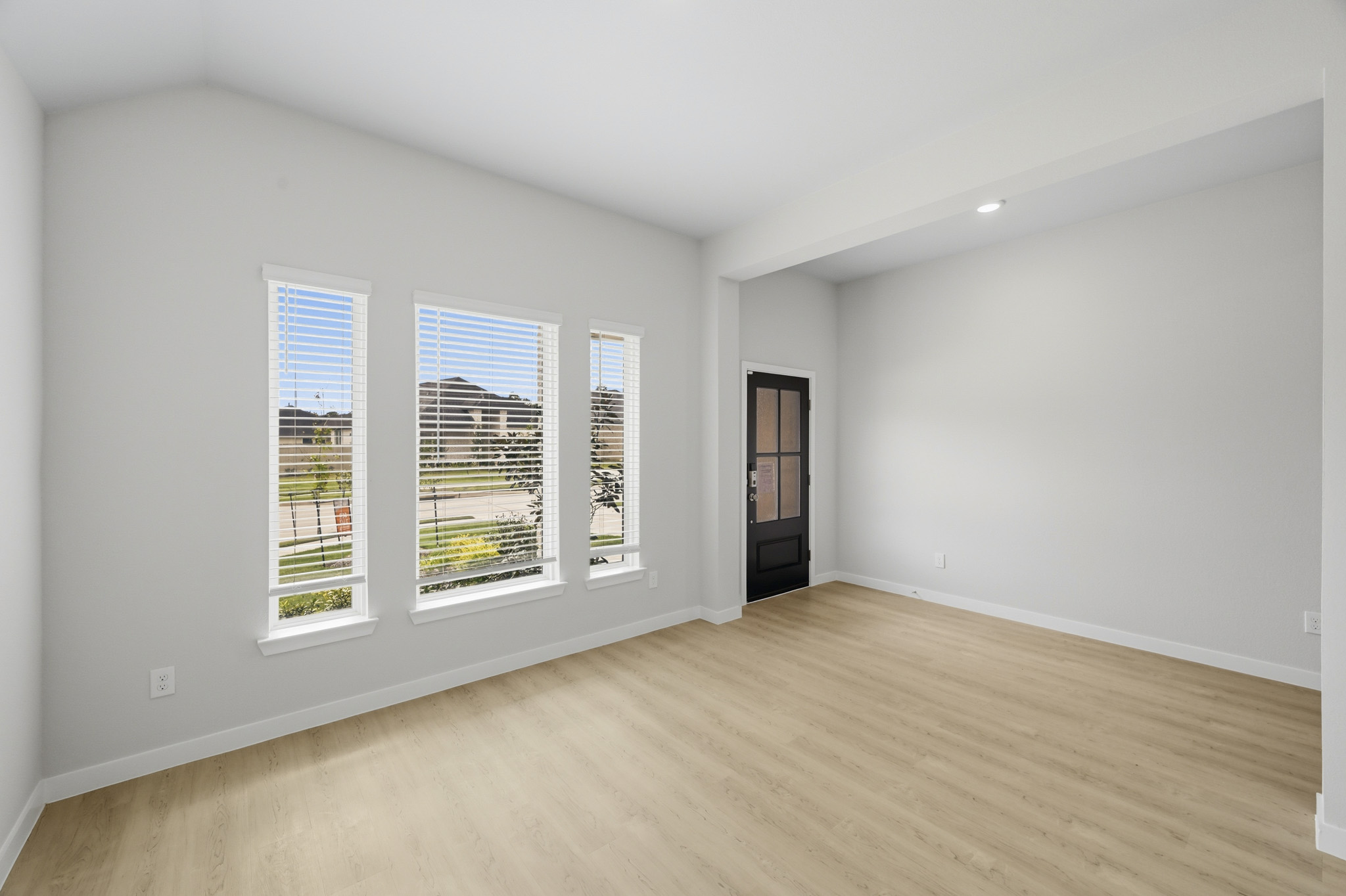 A room with a wood floor and a wood floor.