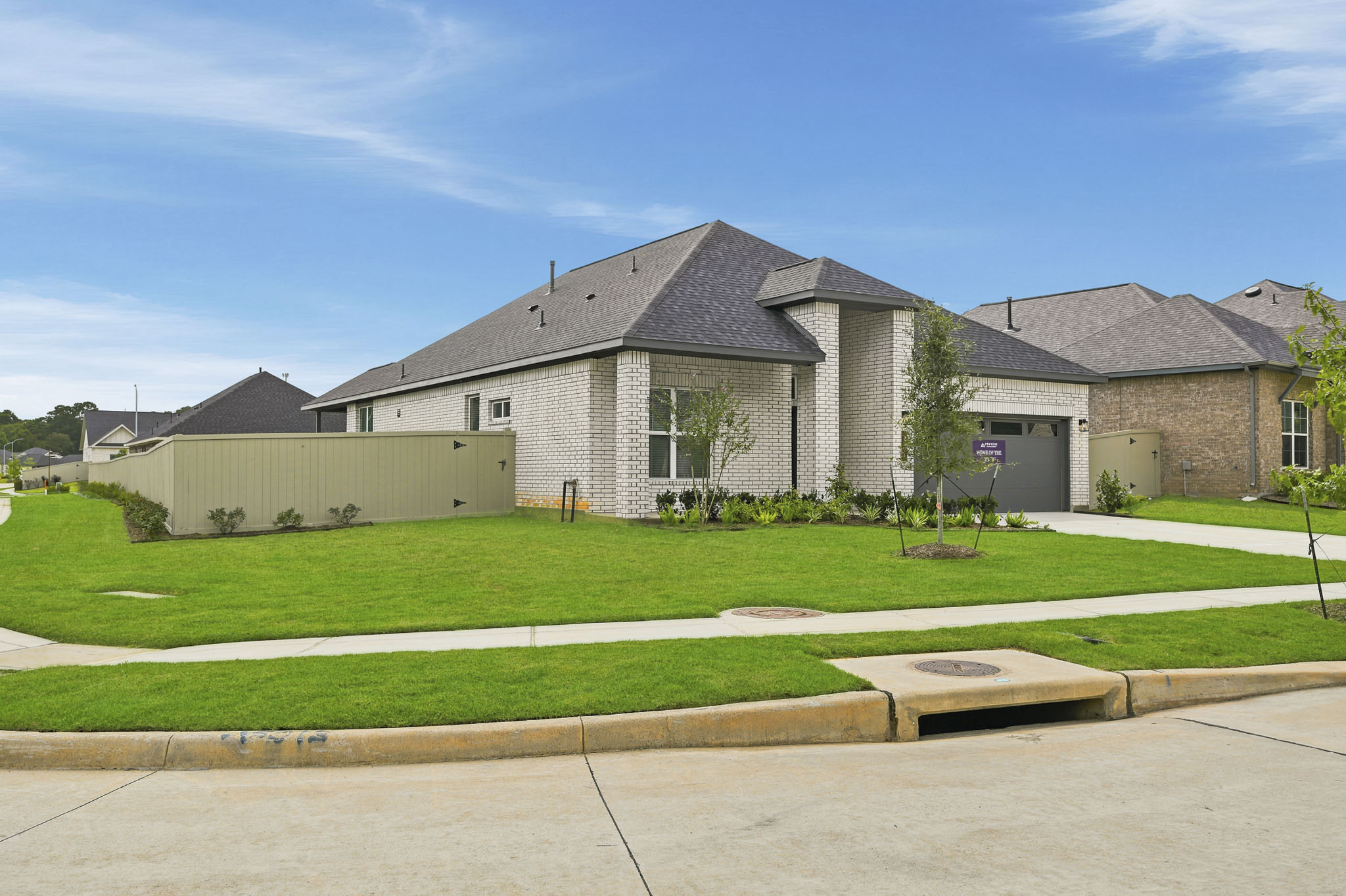 A large house with a fence.