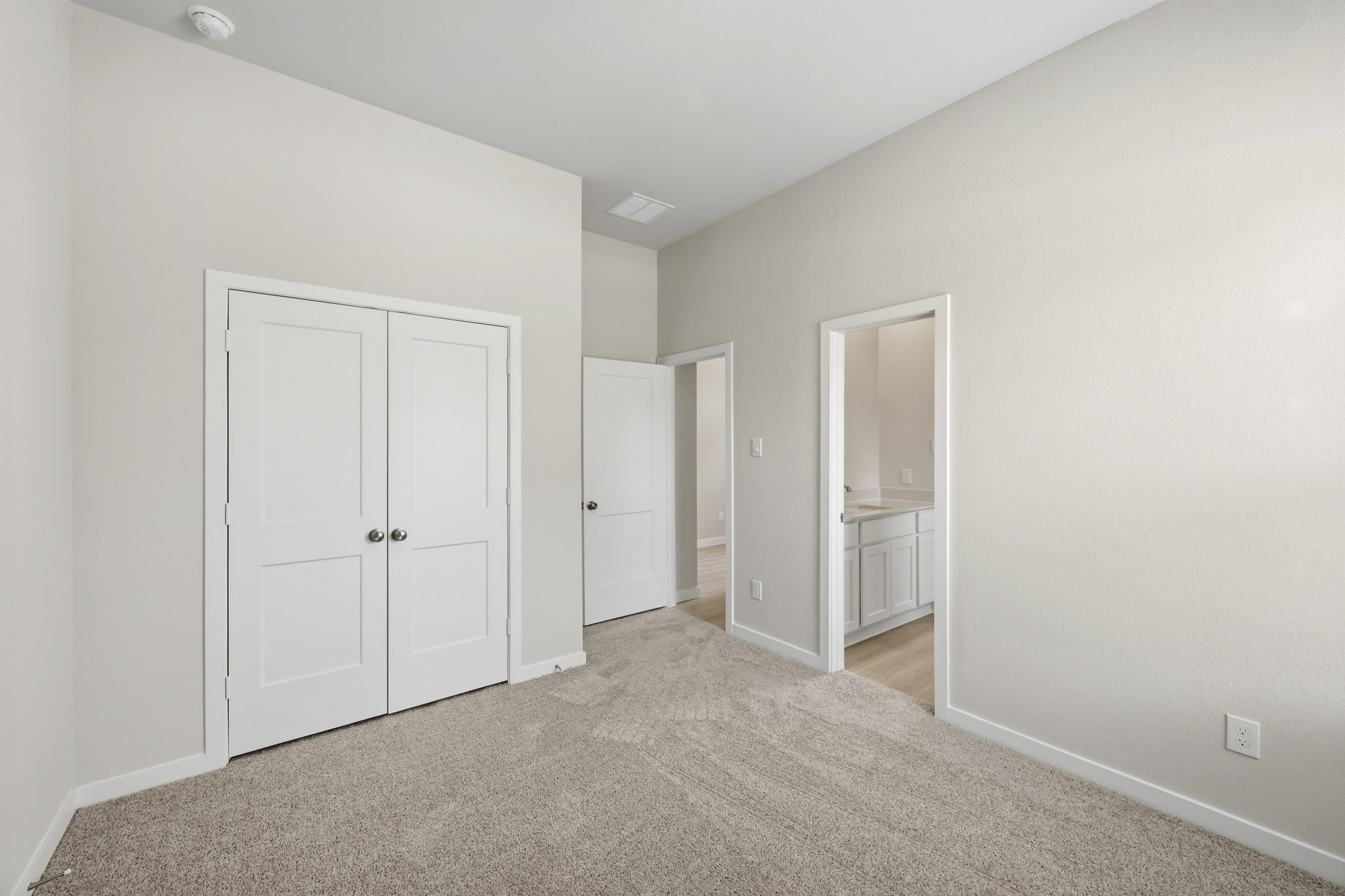 A room with white doors.
