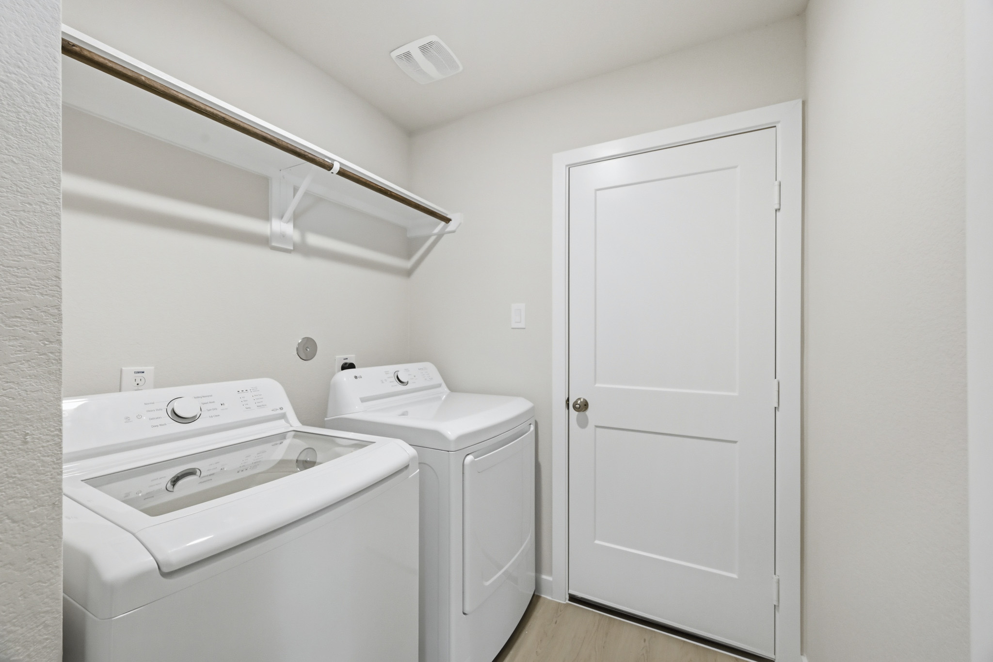 A washer and dryer in a room.