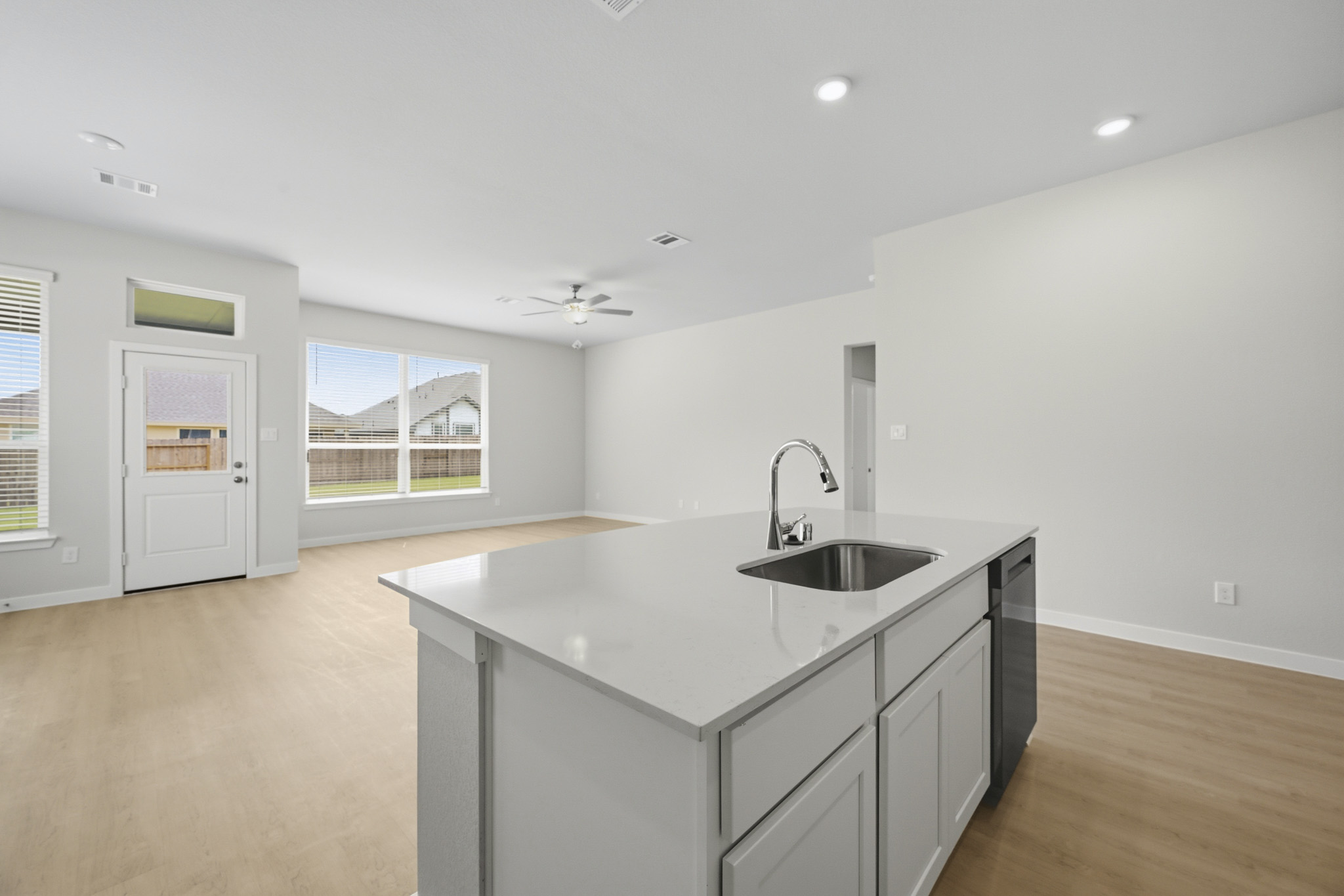 A kitchen with a sink and cabinets.