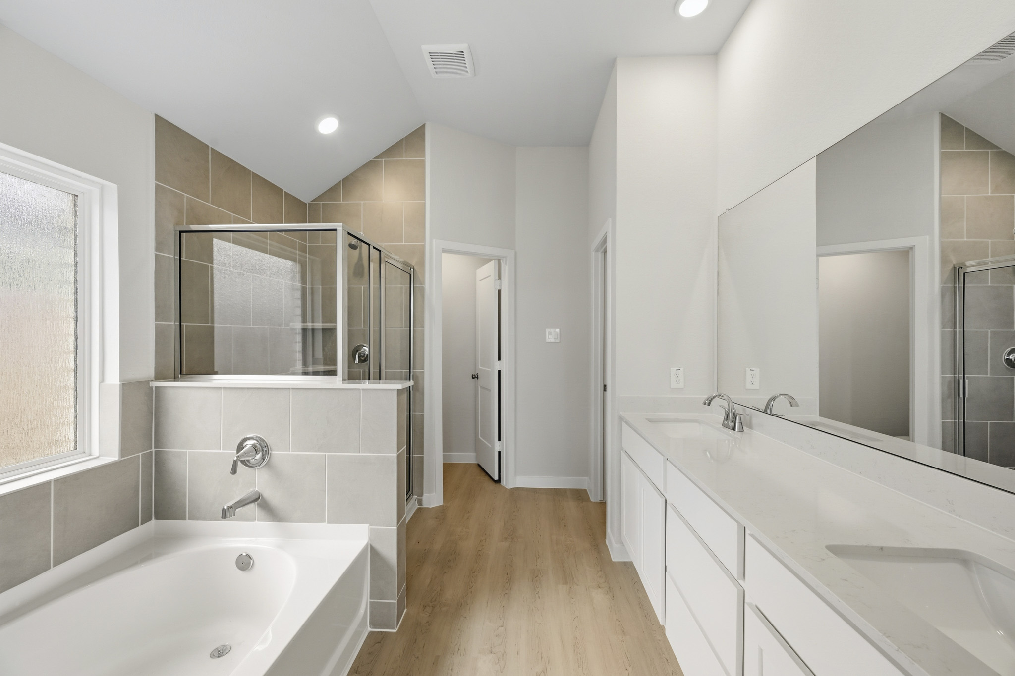 A bathroom with a tub and sink.