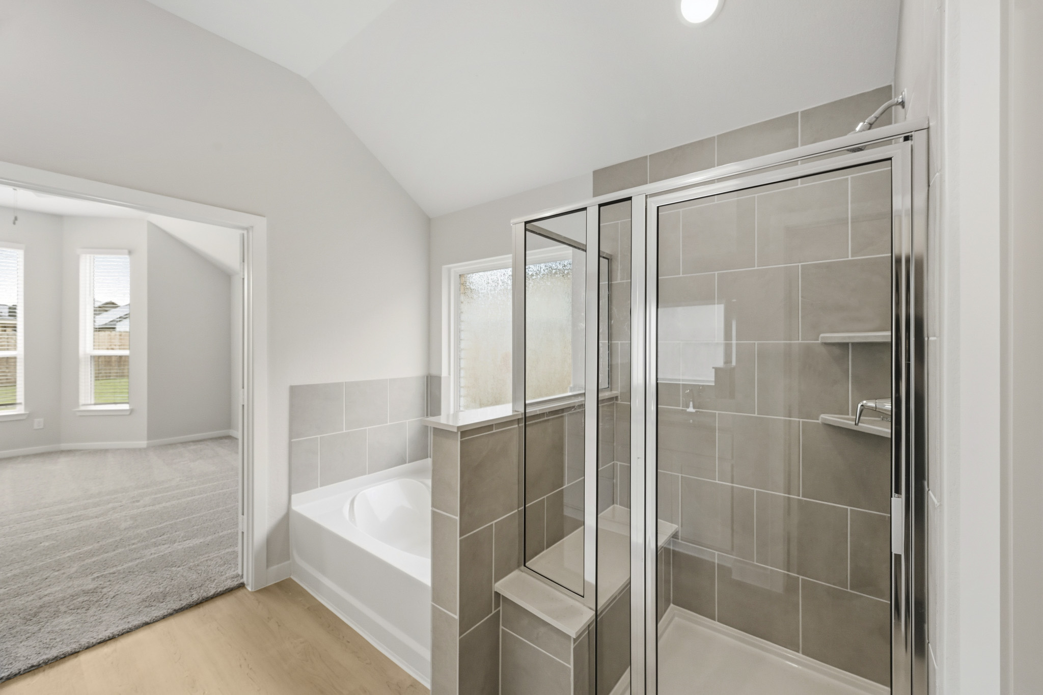 A bathroom with a glass shower.