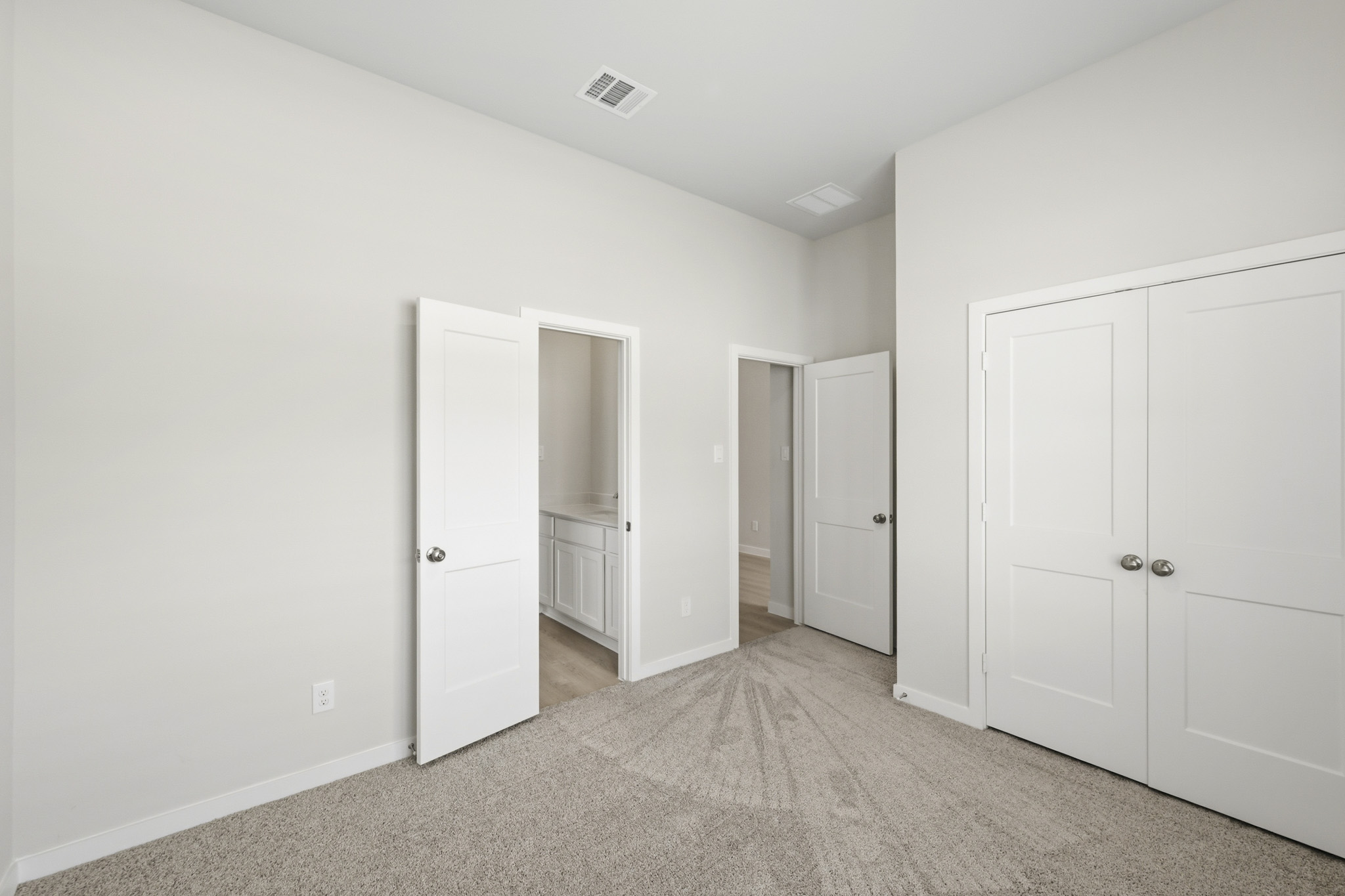 A room with white doors.