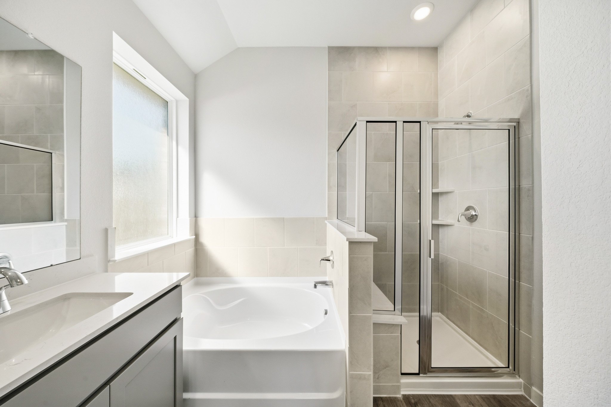 A bathroom with a glass shower.