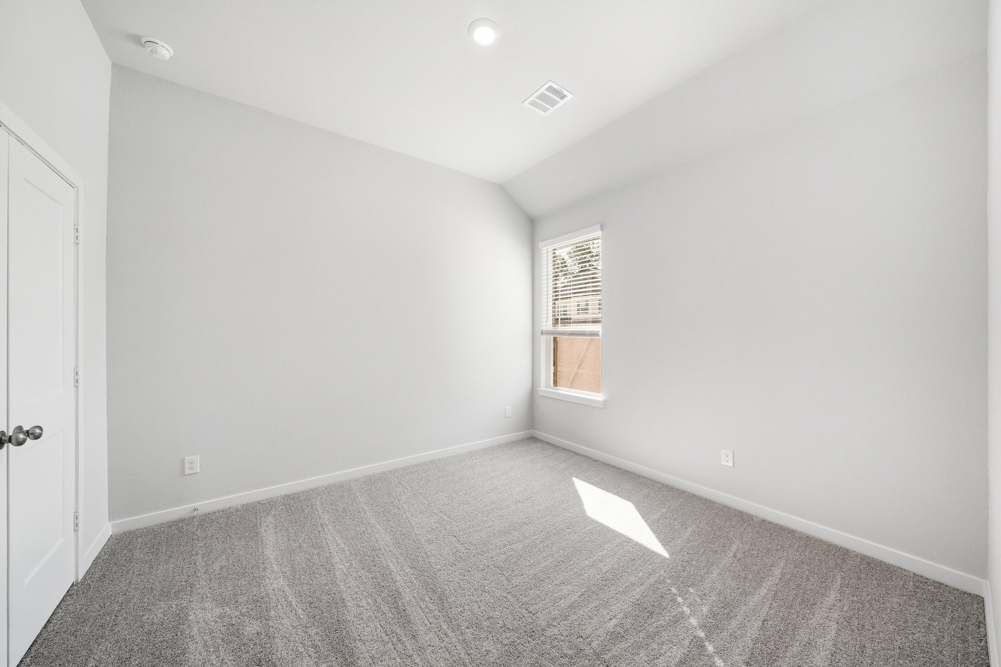 A room with a door and a window.