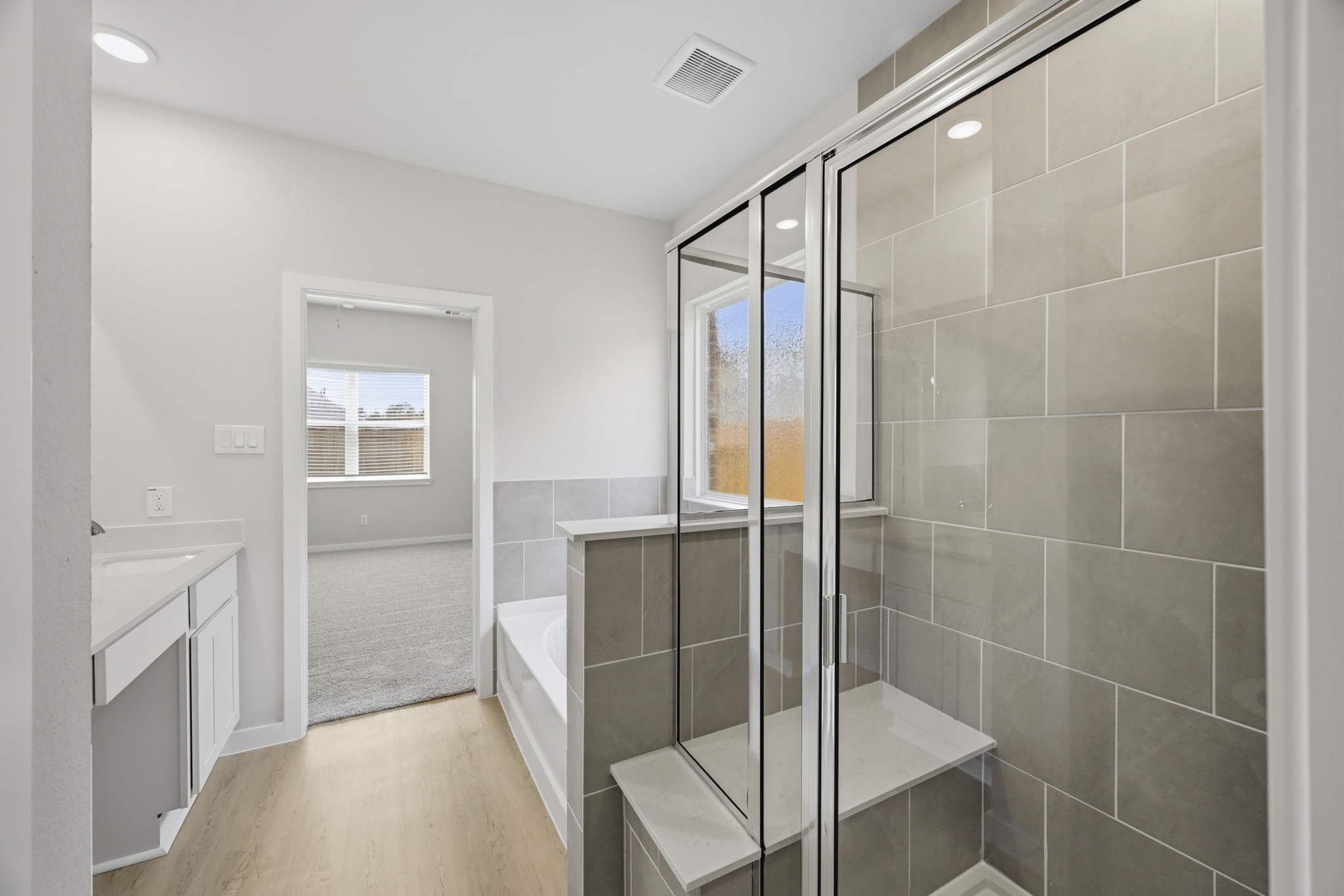 A bathroom with a glass shower.