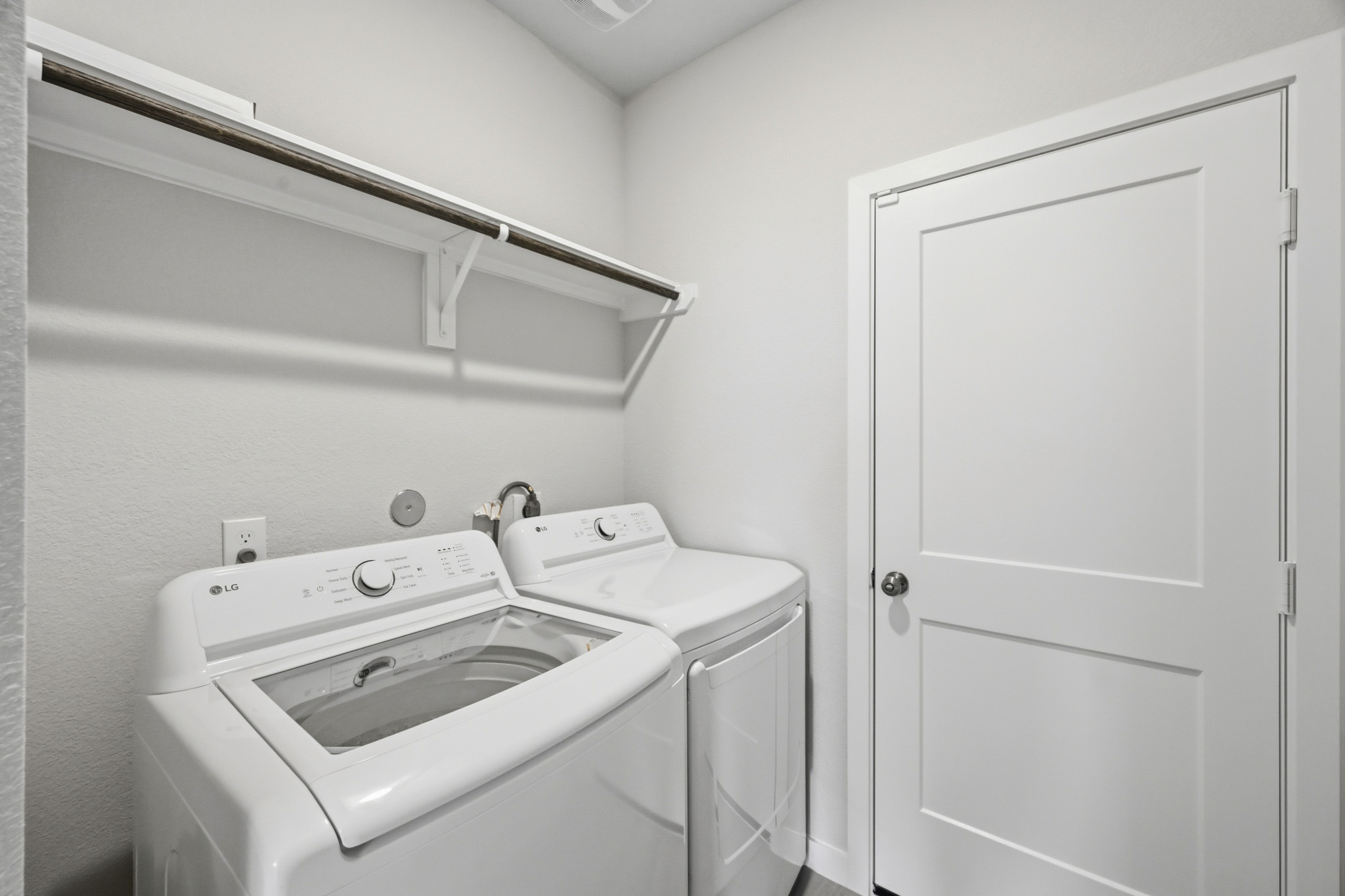 A washer and dryer in a room.