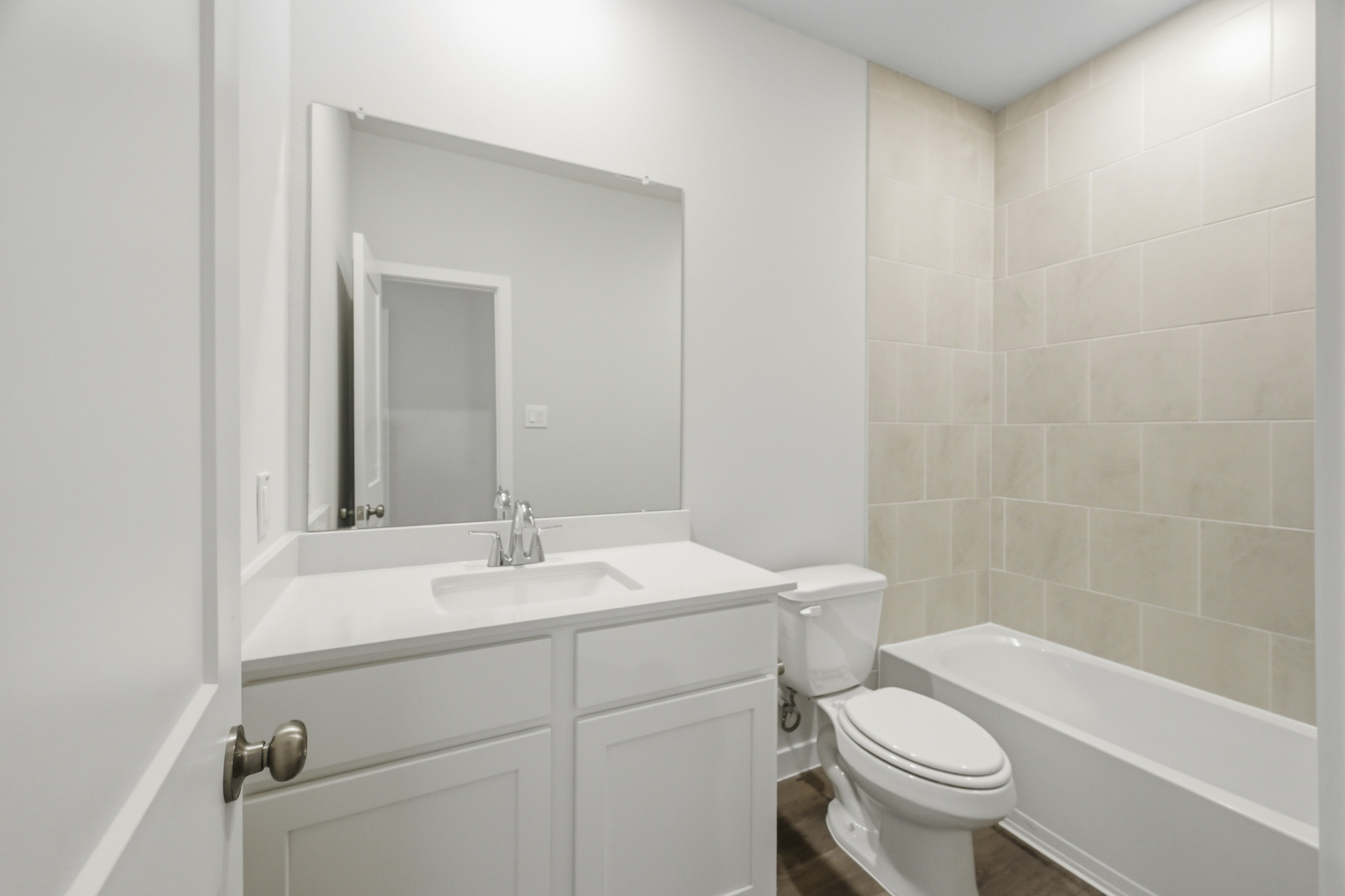 A bathroom with a toilet and sink.