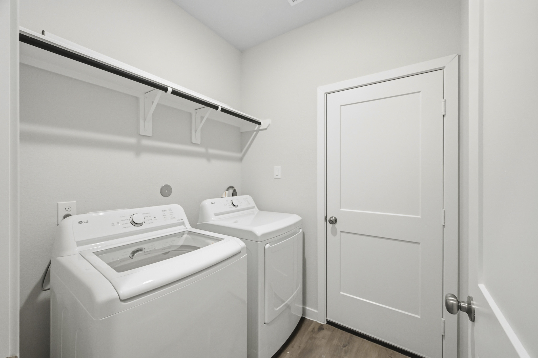 A washer and dryer in a room.