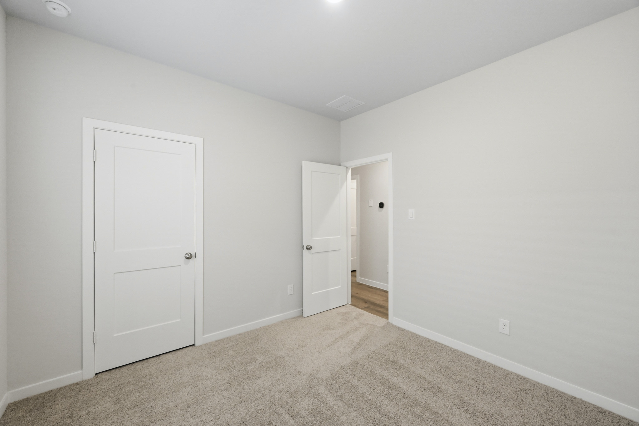 A room with white doors.
