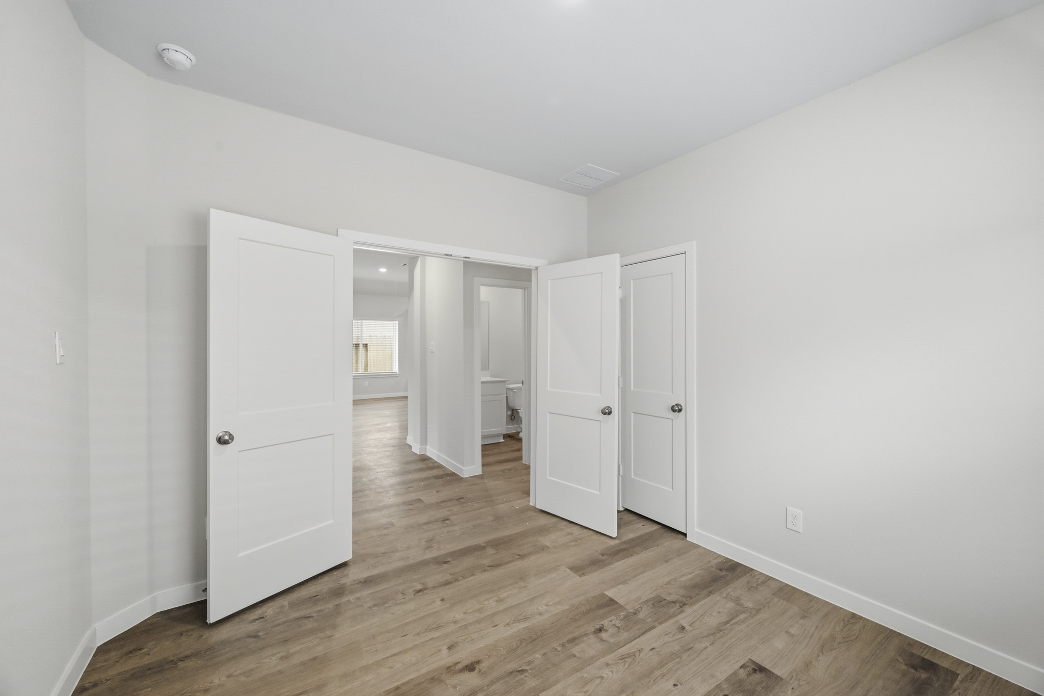 A room with white cabinets.