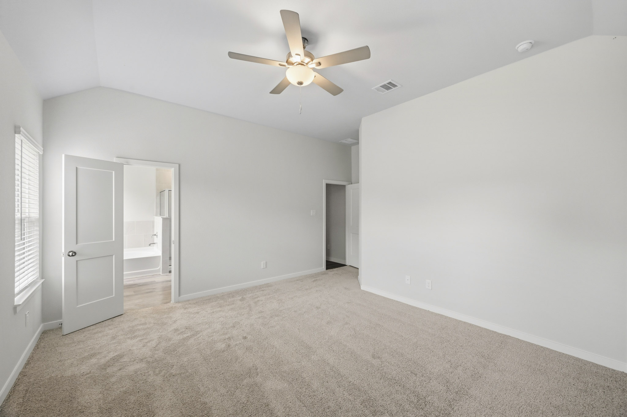A room with a ceiling fan and a ceiling fan.
