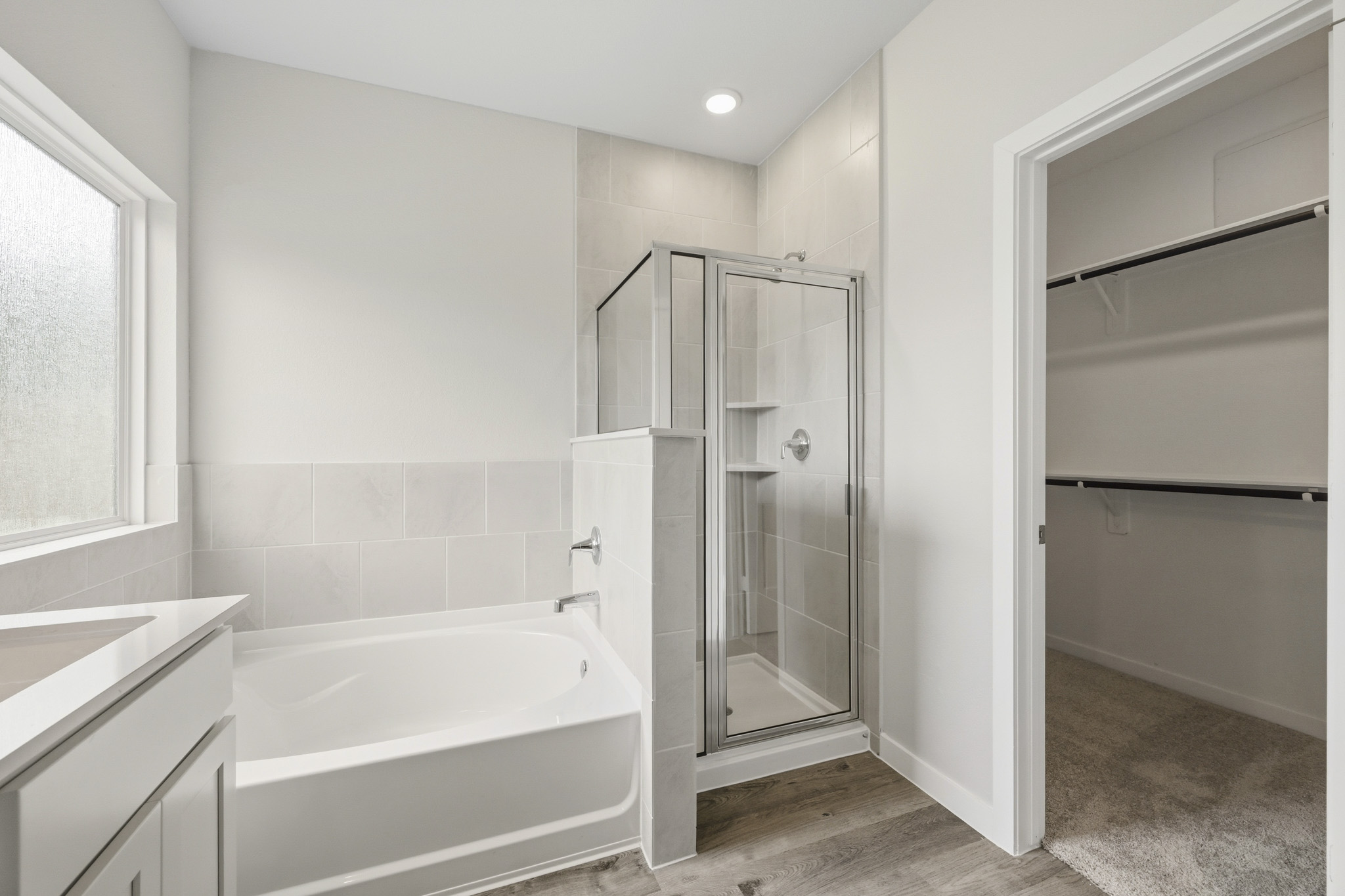 A bathroom with a glass shower.