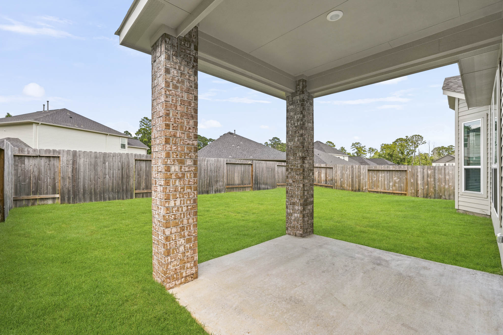 A stone structure in a yard.