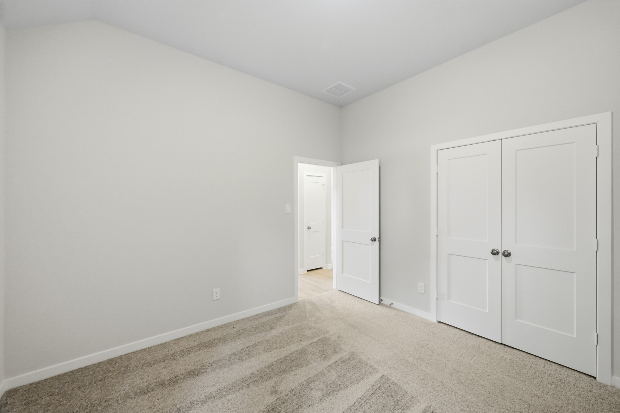 A room with white doors.