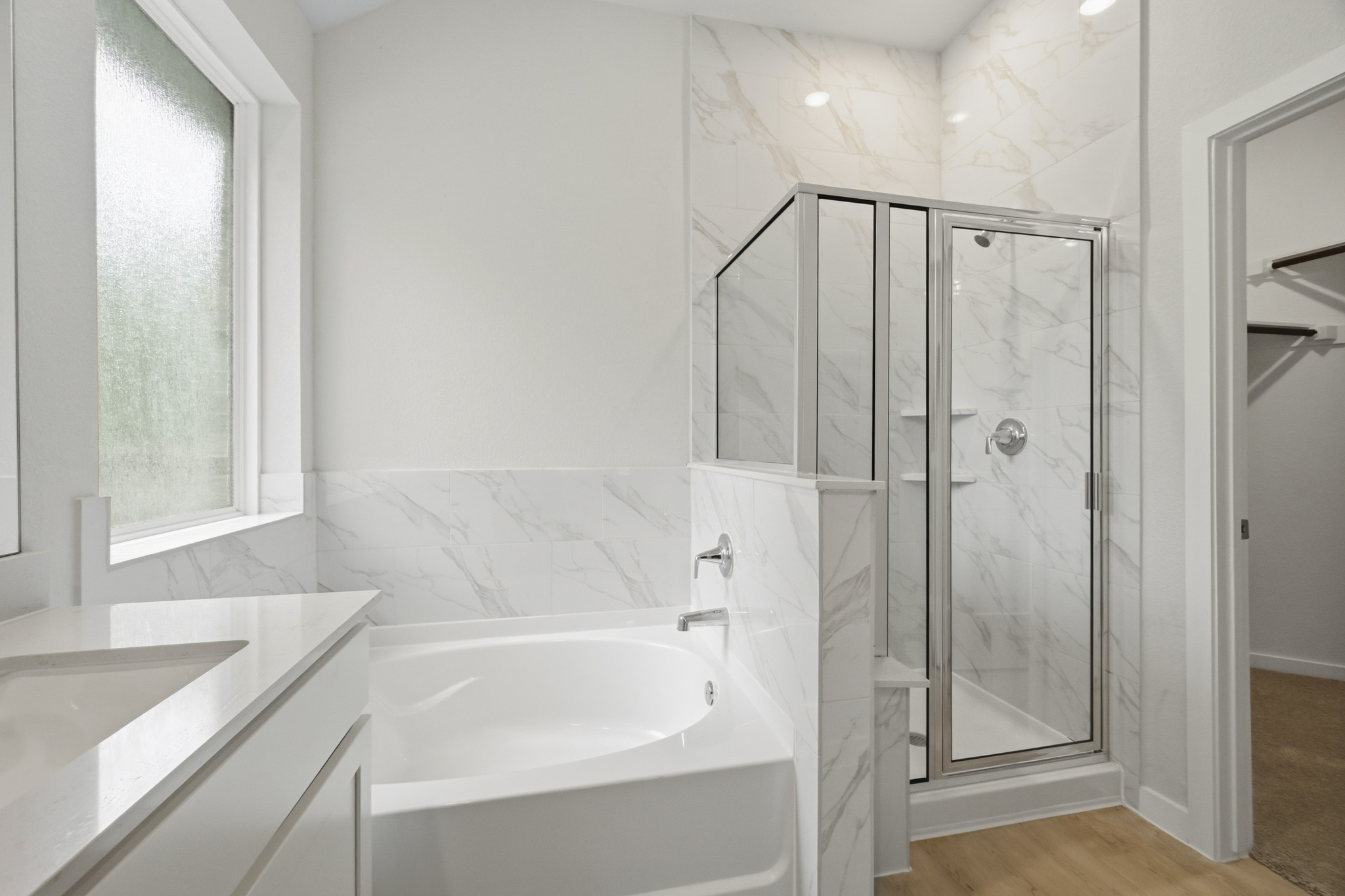 A bathroom with a glass shower.