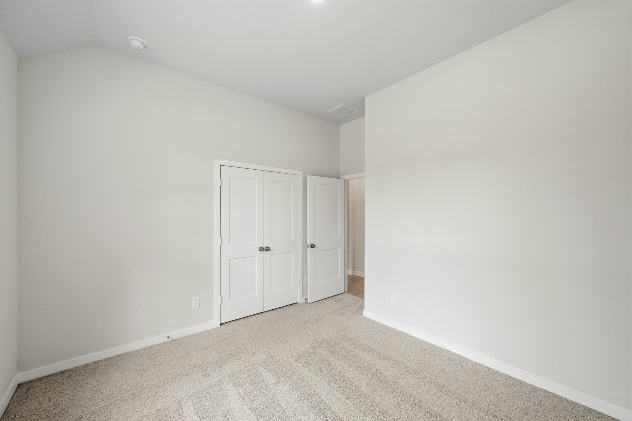 A room with white doors.