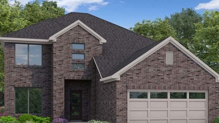 A brick house with a garage with Eudora Welty House in the background.