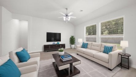 A living room with a tv and couches.