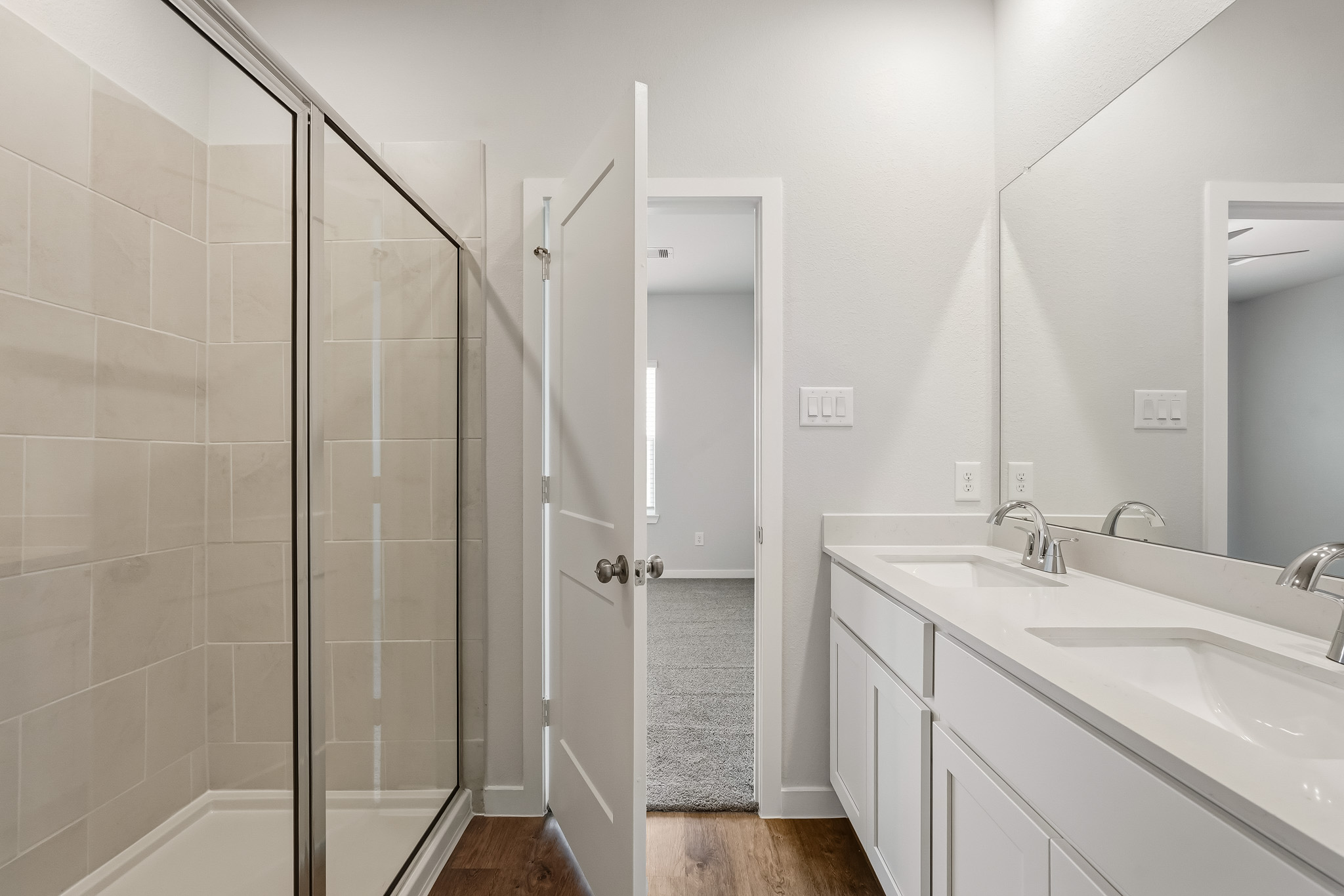 A bathroom with a glass shower.