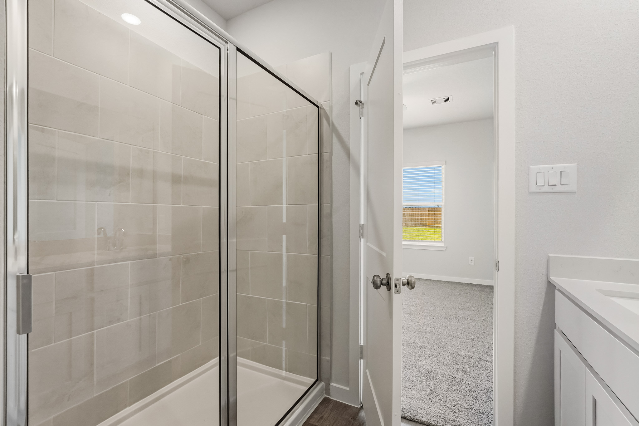 A bathroom with a glass shower.