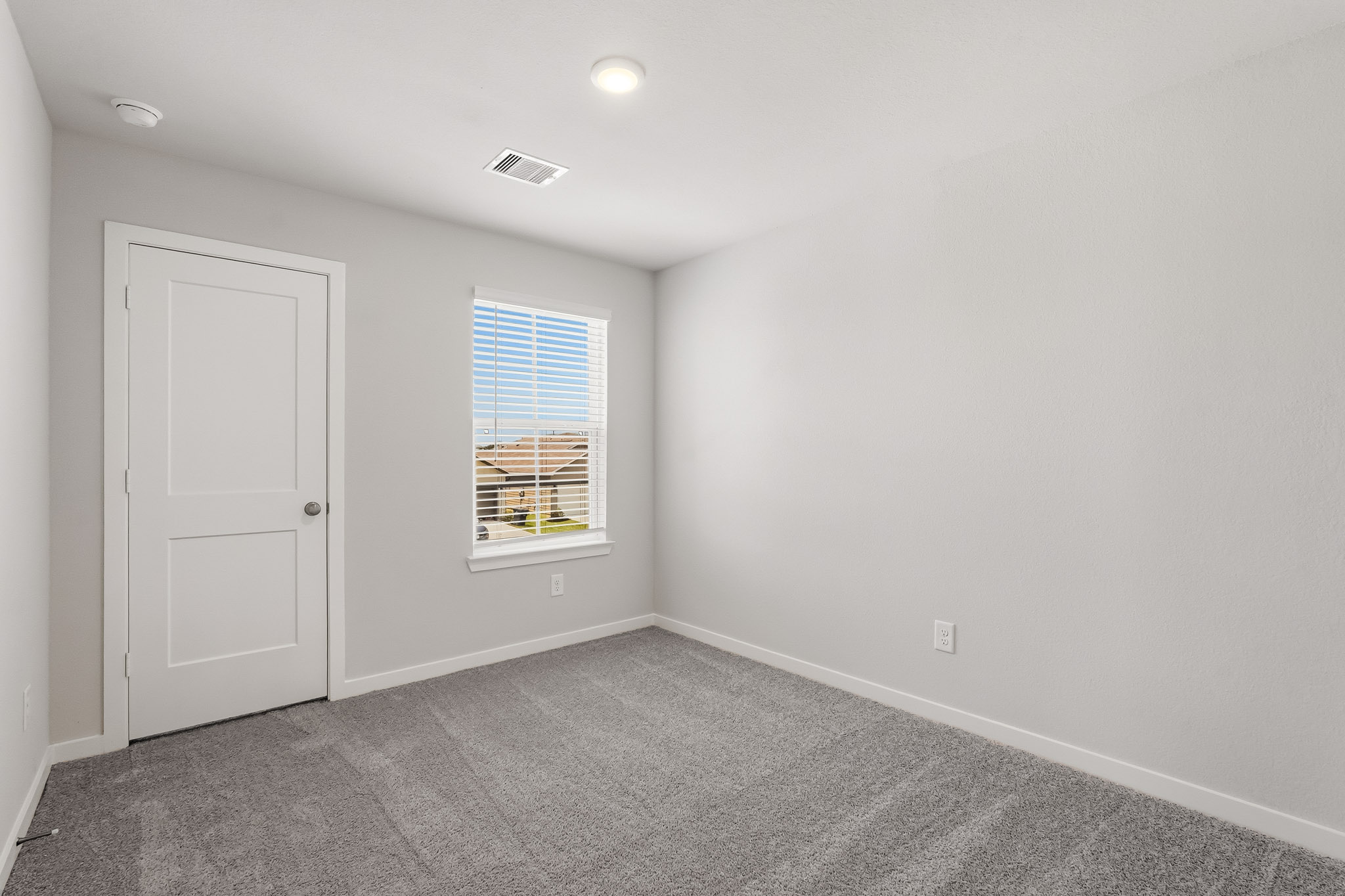 A room with a door and a window.