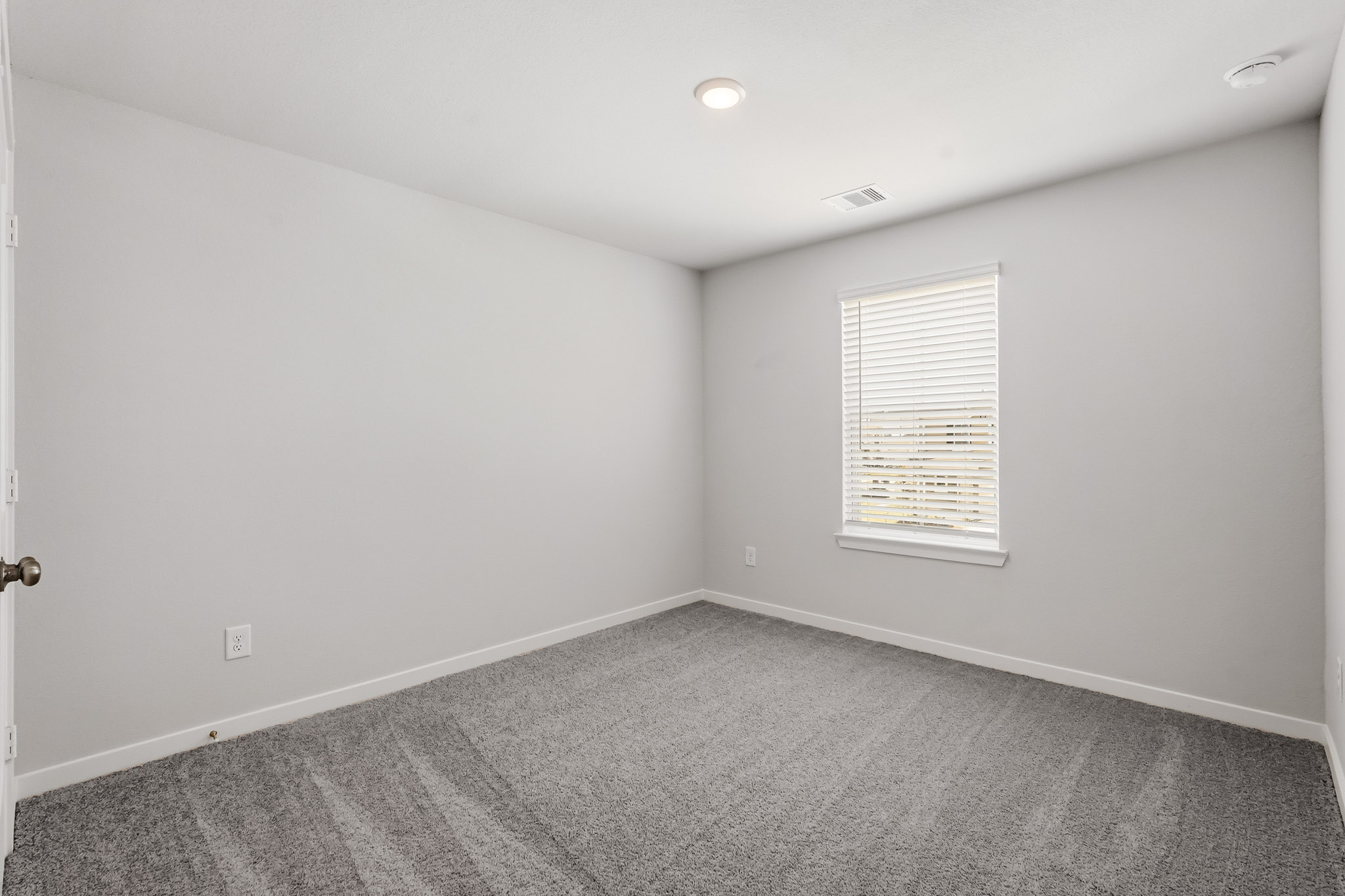 A room with a door and a window.