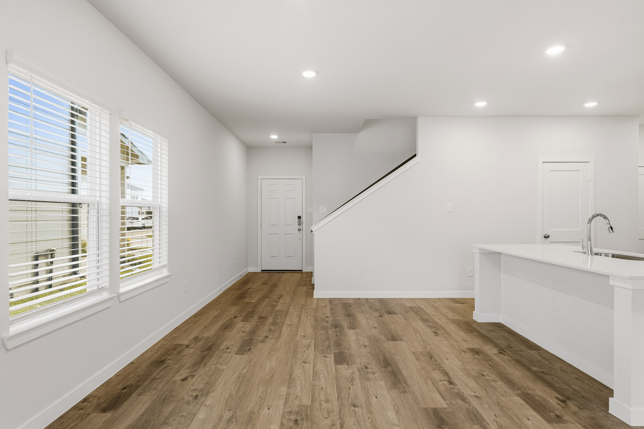 A bathroom with a wood floor.