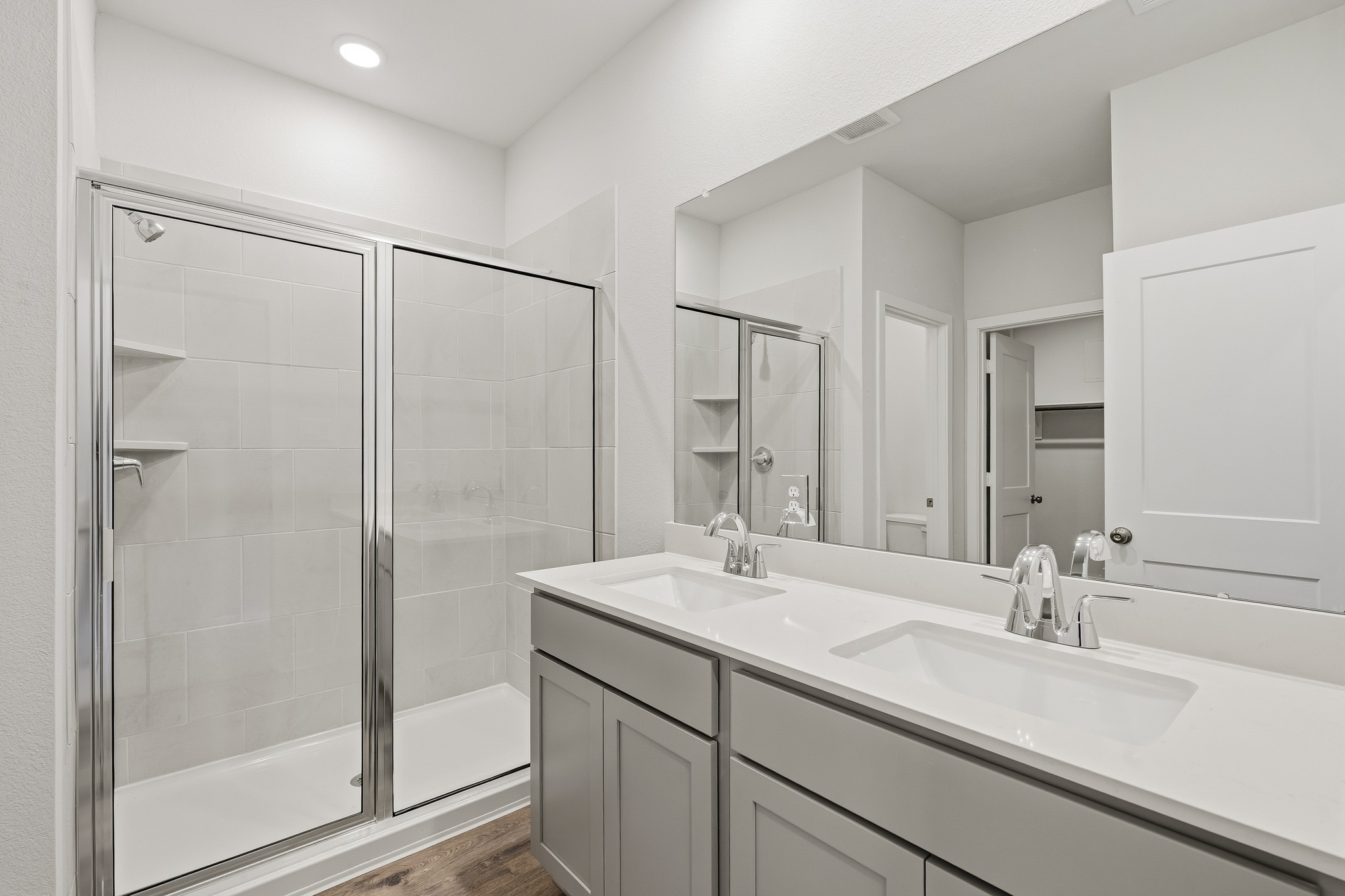 A bathroom with a glass shower.