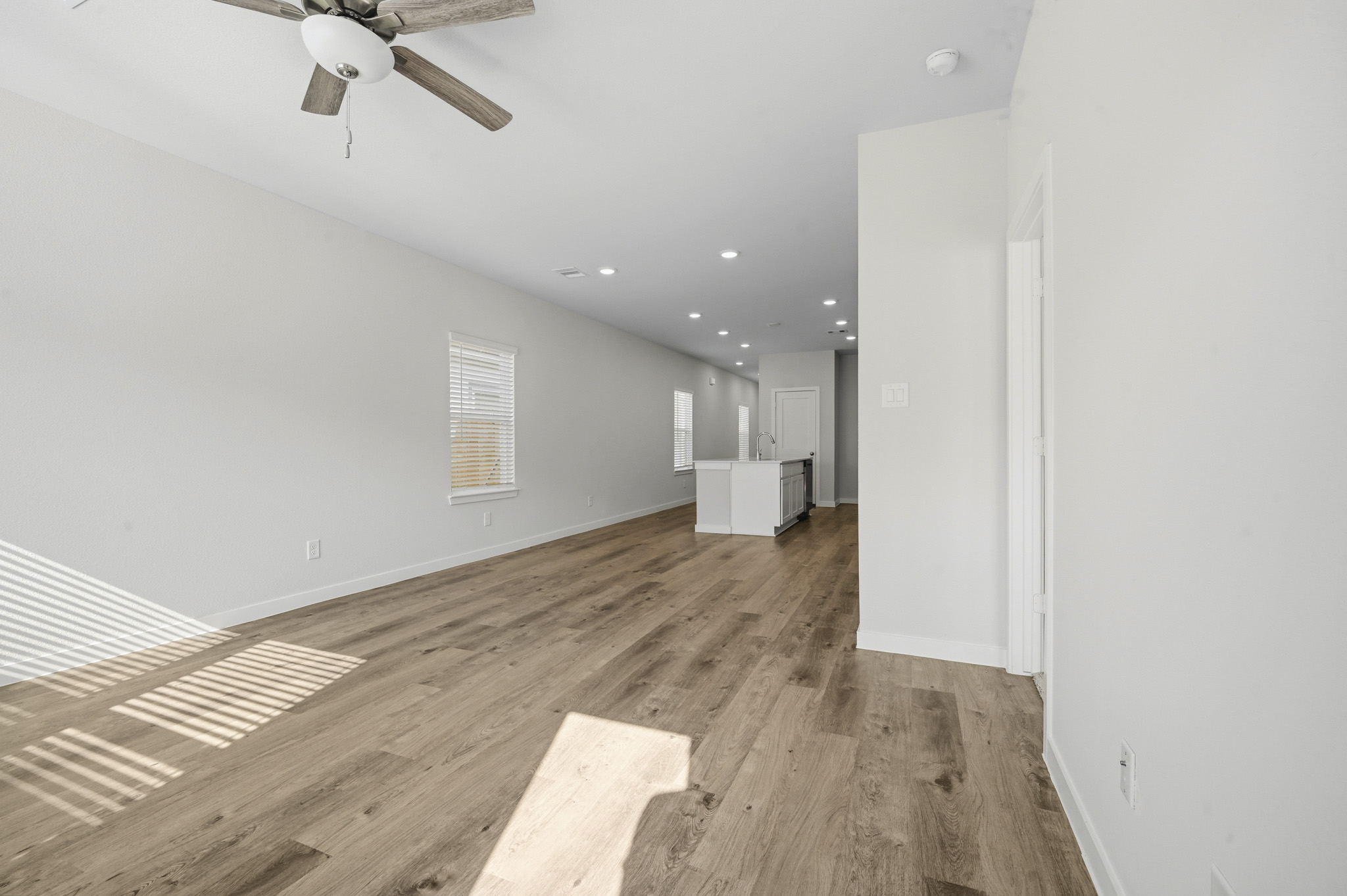 A room with a wood floor and a wood floor.