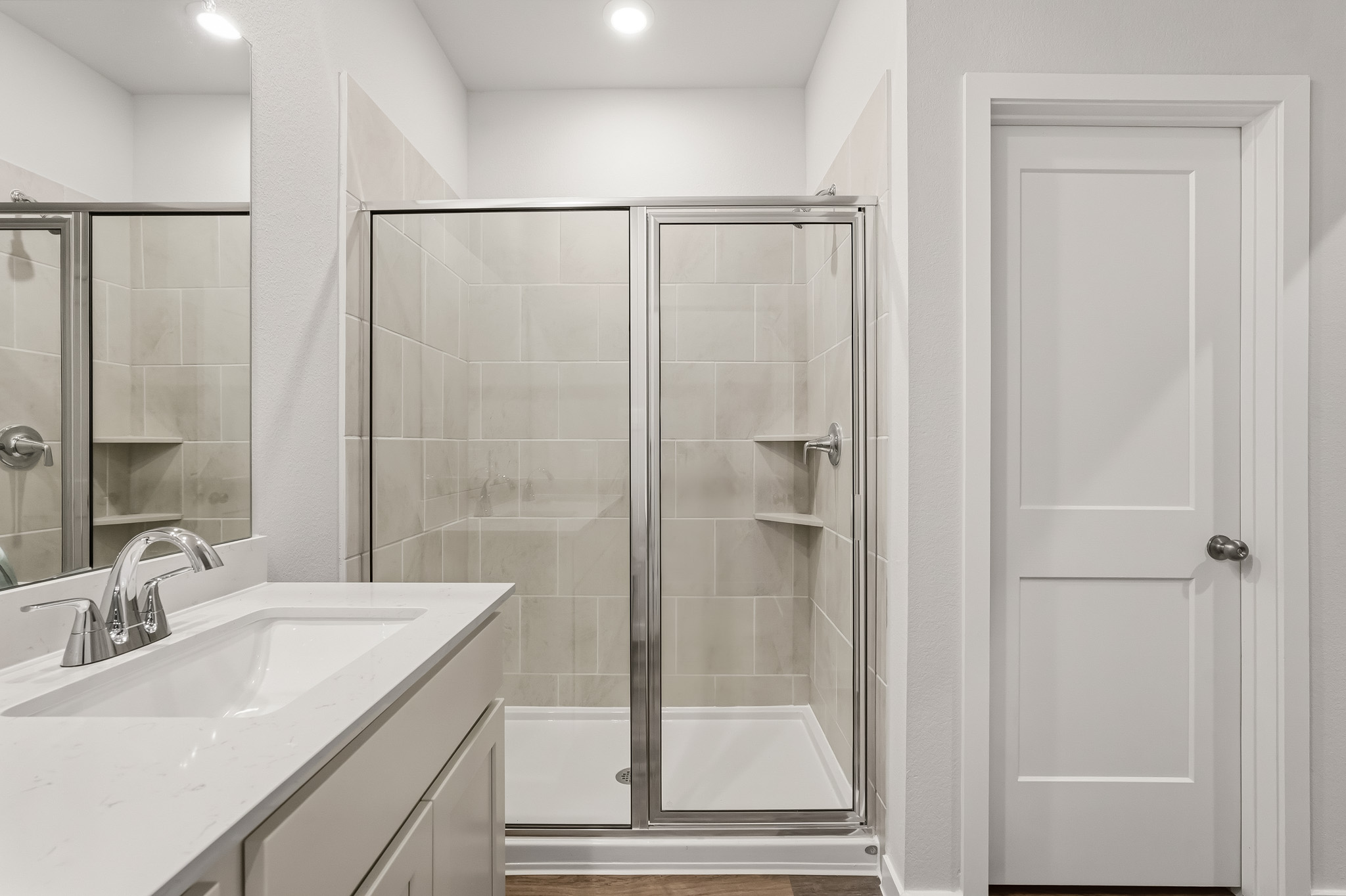 A bathroom with a glass shower.