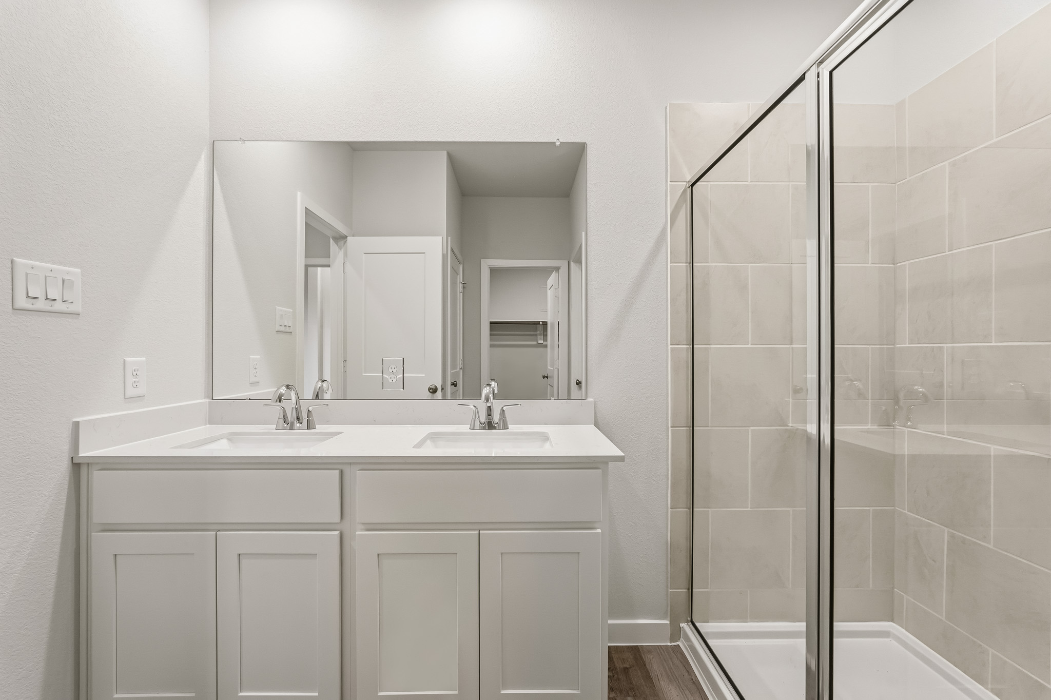 A bathroom with a glass shower.