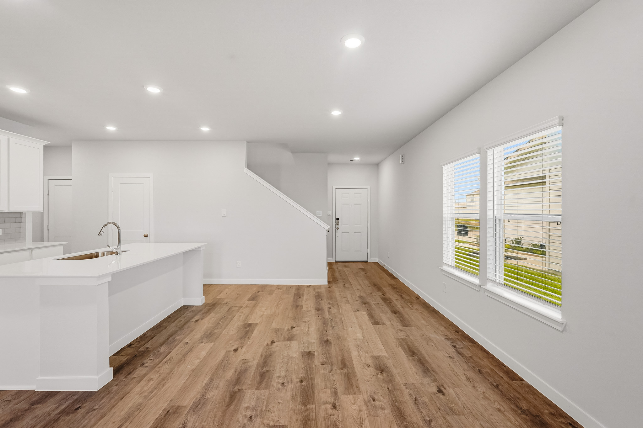 A kitchen with white walls.