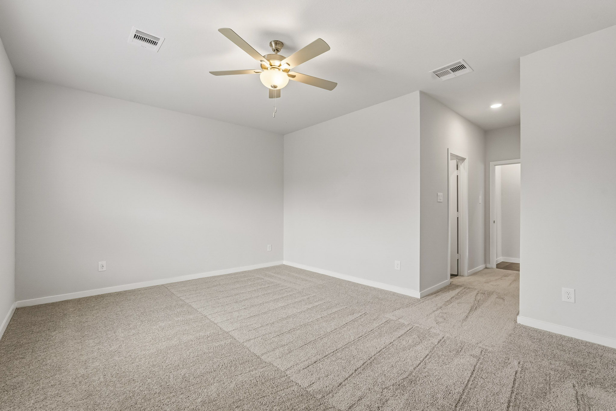 A room with a ceiling fan and a ceiling fan.