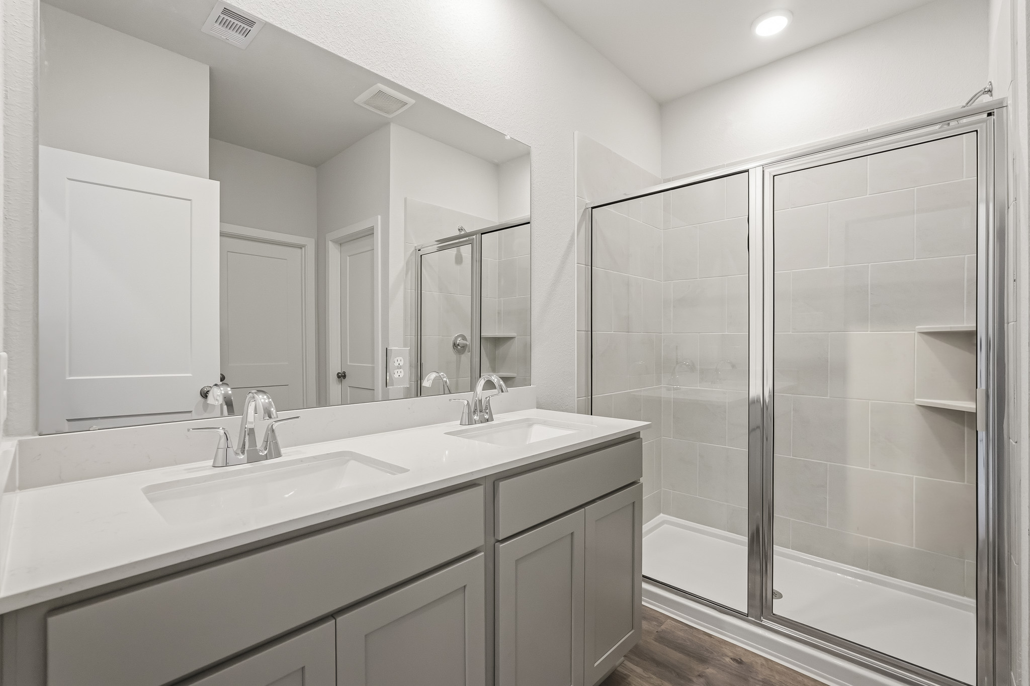 A bathroom with a glass shower.