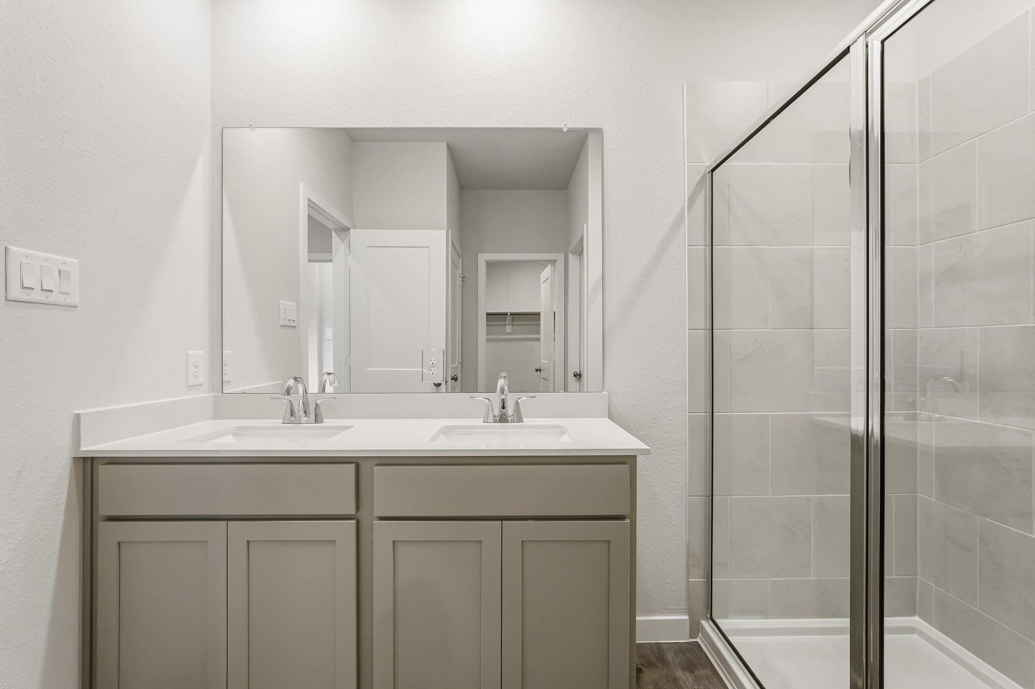 A bathroom with a glass shower.