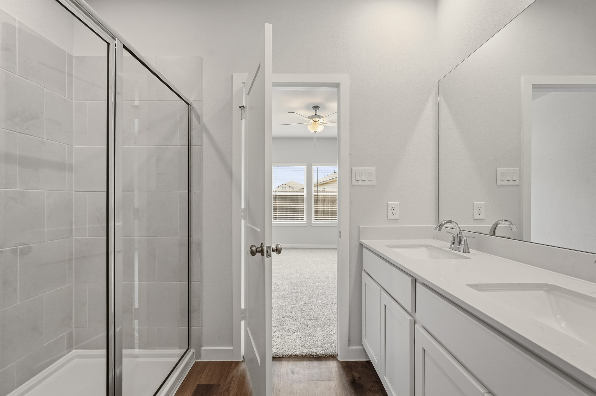 A bathroom with a glass shower.