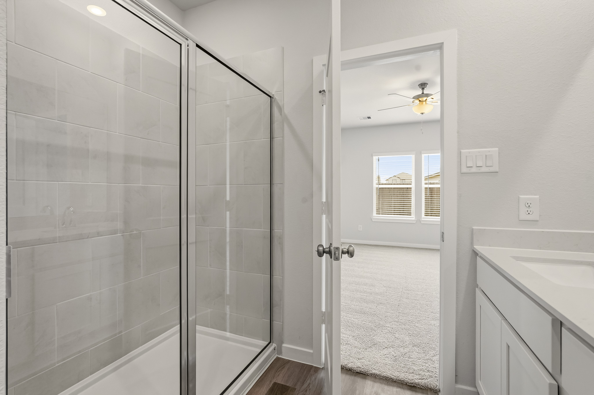 A shower with a glass door.