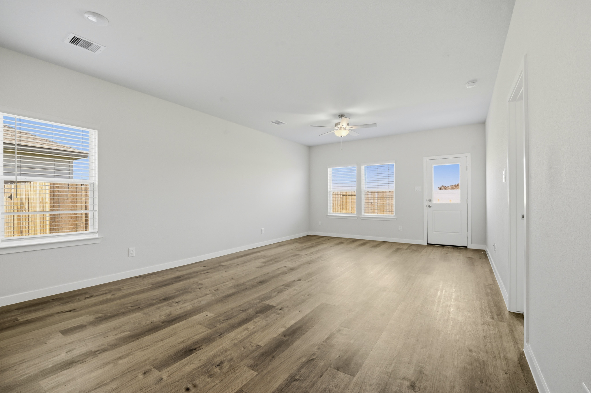 A room with a wood floor and a wood floor.