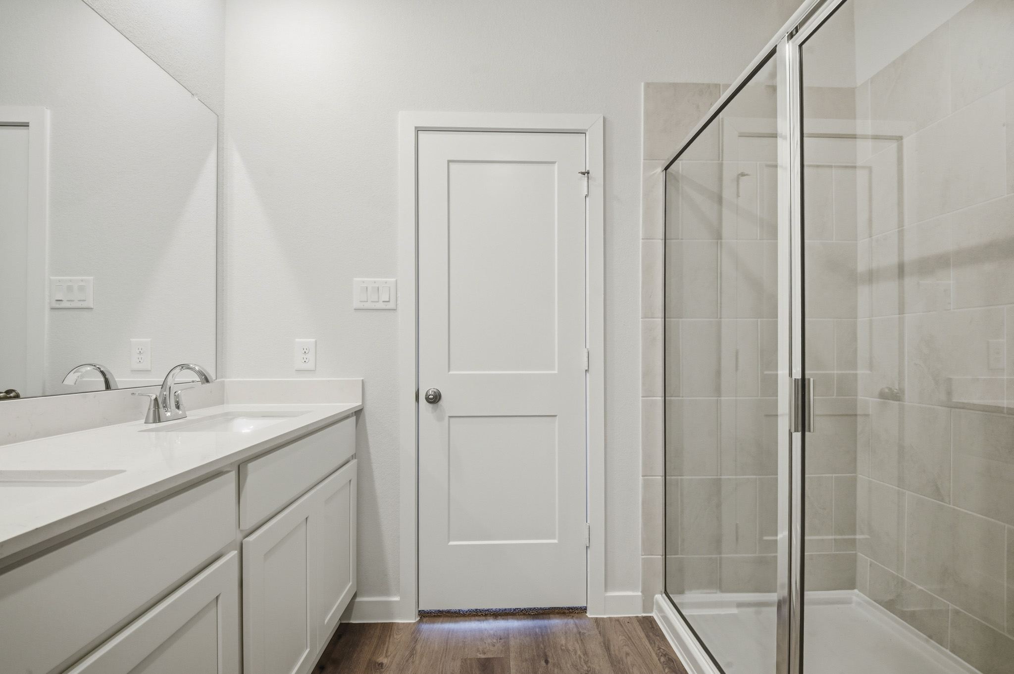 A bathroom with a glass shower.